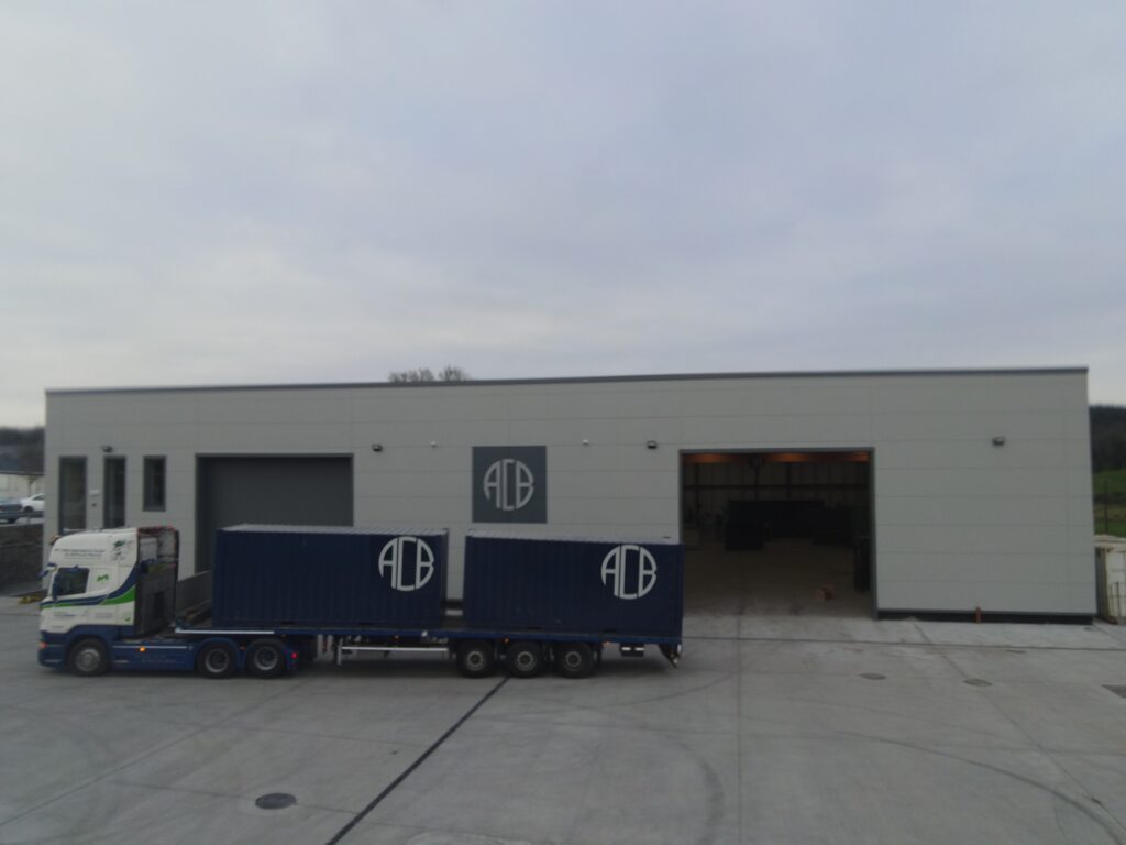 Two ACB Group manufacturing containers on a lorry